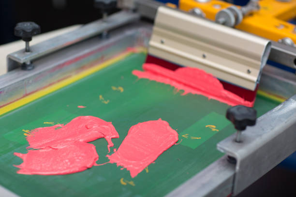 istock Silk screen printing. Serigraphy. Color paints and fabric. Plastisol paint and squeegee. 1215606069