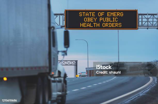 Trucking During State Of Emergency Stock Photo - Download Image Now - Road Sign, State of Emergency, Sign