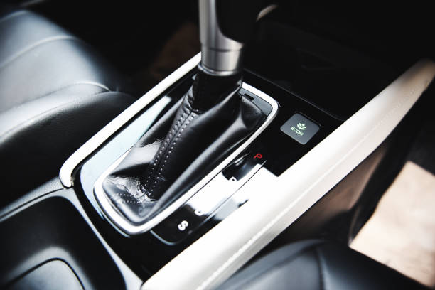 istock Automatic car transmission shift lever interior car detail - automatic gear and button econ mode Reducing fuel consumption 1215611396
