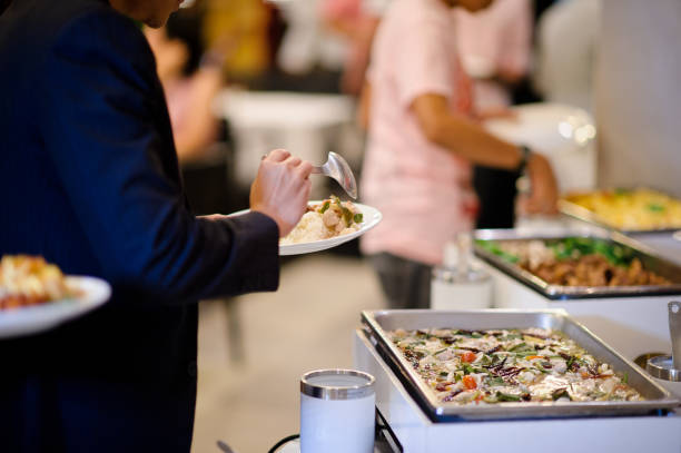 istock scooping the food, catering, dinner time 1215613124