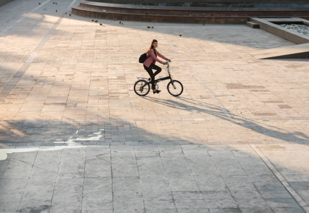istock Young woman commuting by bike 1215613963