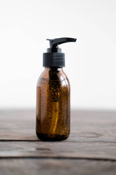 istock Cosmitics dark amber bottle with pump 1215614353