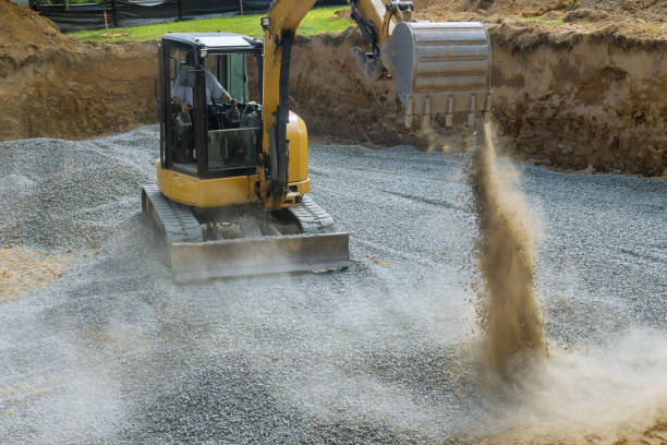 istock A excavator in a working to gravel construction equipment for foundation construction. 1215615095