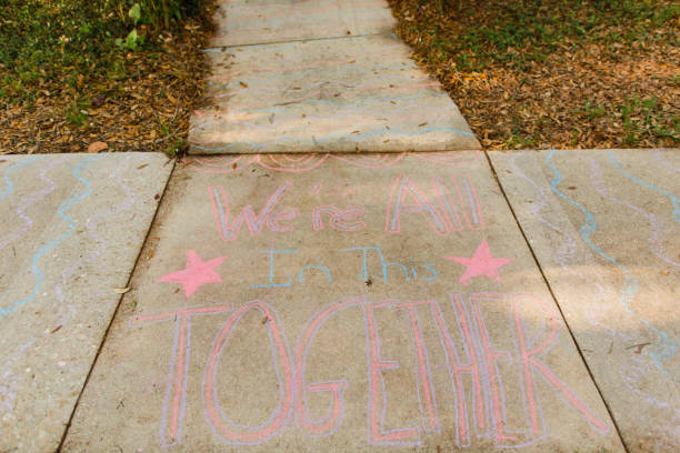 istock Covid-19 Inspirational Sidewalk Chalk Art 1215615189