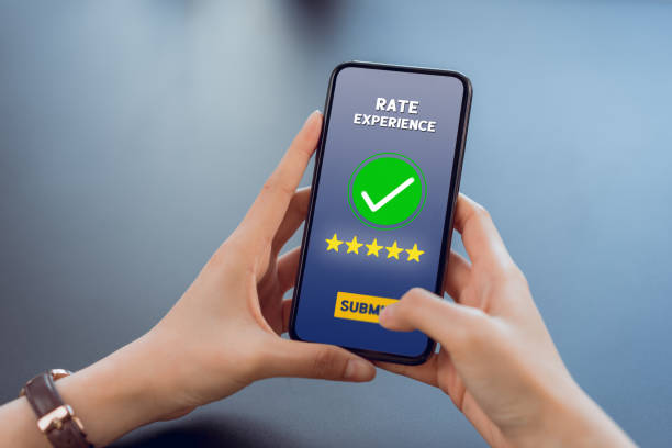 istock Hand holding smartphone rate your experience on application mobile. 1215620267