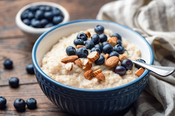 istock Oatmeal porridge with blueberries and almonds 1215625159