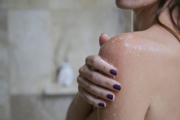 istock Young beautiful woman taking shower in bathroom` 1215633920