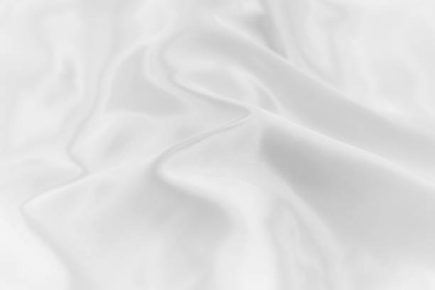 istock Soft focus of white color silk fabricl background texture. 1215634849