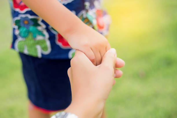 istock Mother's and a child hands 1215636942