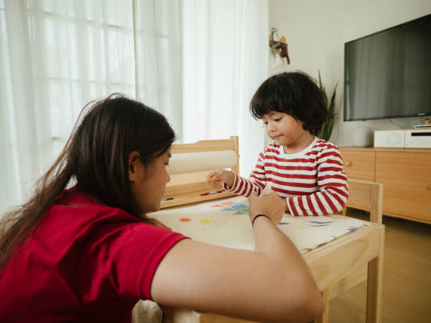 istock Mother with son studying at home 1215637665