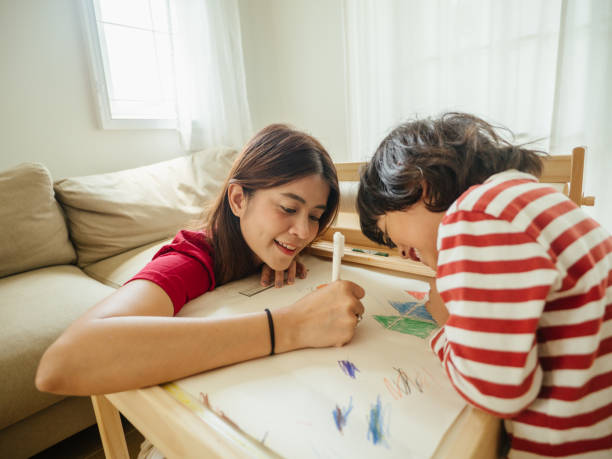 istock Mother with son studying at home 1215637677
