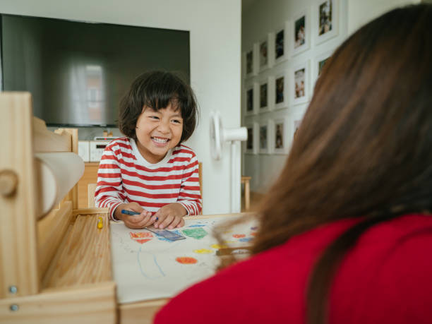 istock Mother with son studying at home 1215637831