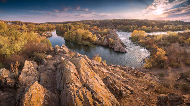 istock Panorama of sunset over the autumn river valley 1215638392