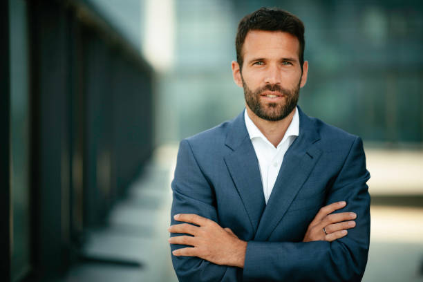 istock Young handsome man in a blue suit. 1215639186