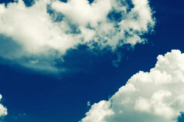 istock Incredibly wonderful lush cumulus clouds against a blue sky 1215646403