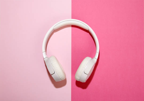 istock White headphones on a duo tone pink background 1215648561