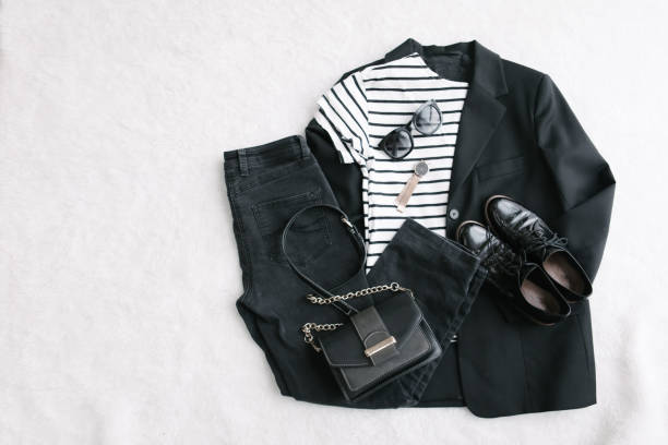 istock overhead flat lay view woman clothes black and white 1215648870