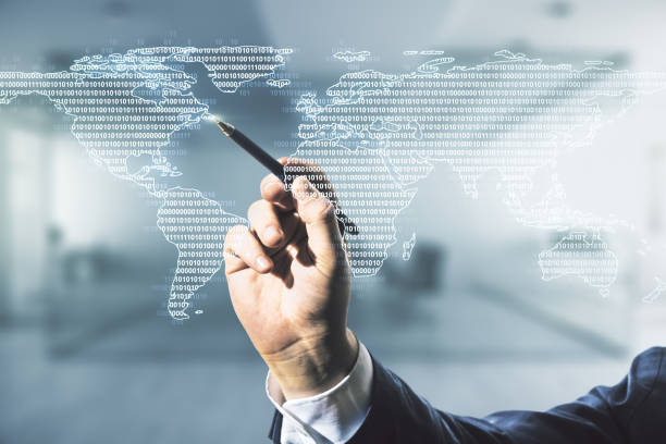 istock Multi exposure of businessman hand with pen working with abstract graphic world map on blurred office background, big data and networking concept 1215648974