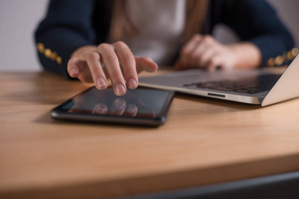 istock Woman hands touching tablet screen 1215649127