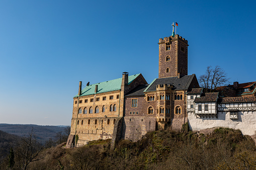 Eisenach, Thuringia, Germany - March 26, 2020: The Wartburg Castle at Eisenach in Thuringia Germany with blue sky in the springtime