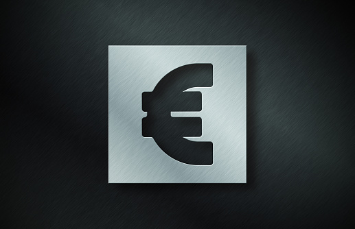Gray Metal Plate With Euro Symbol On Dark Metallic Background. Horizontal composition with copy space.