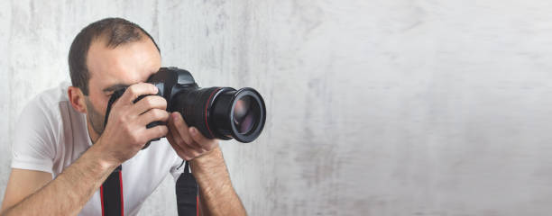 istock Photographer with a Camera. Lifestyle, Work 1215651485