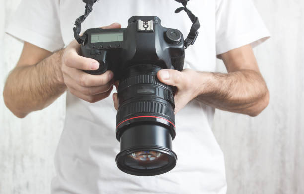 istock Photographer with a Camera. Lifestyle, Work 1215651694