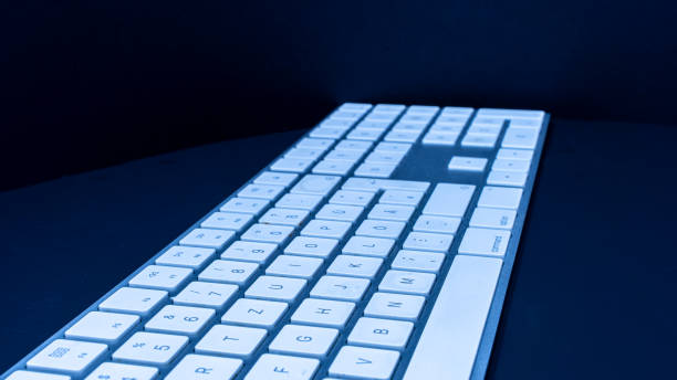 istock Close-Up Of Keyboard On Table In Darkroom 1215654889