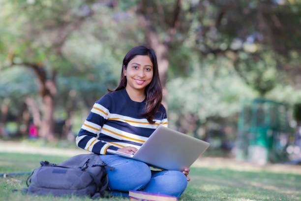 istock Reading a book at park stock photo 1215657010