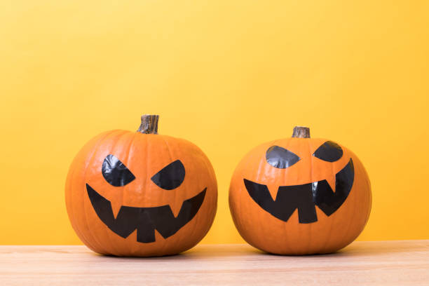 istock halloween pumpkins in color background 1215657319
