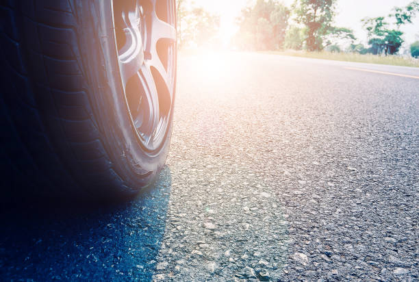 istock Wheels on the road with morning light 1215658582