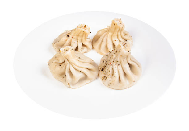 istock boiled khinkali sprinkled with pepper on plate 1215660082