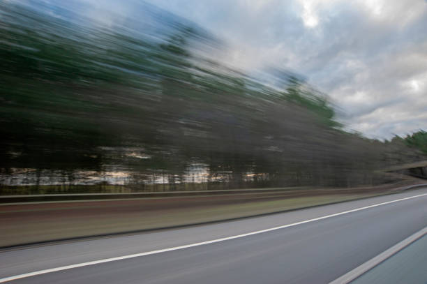 istock View from a car travelling at high speed on a highway 1215660107