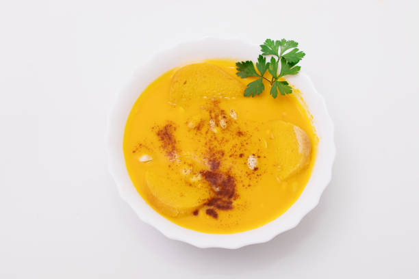 istock cream or pure pumpkin isolated on white background 1215663877