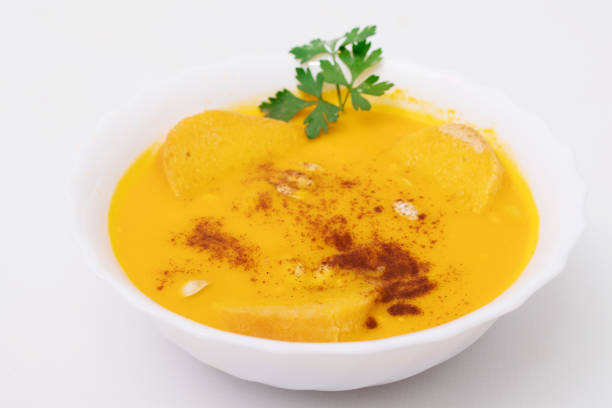 istock cream or pure pumpkin isolated on white background 1215663911