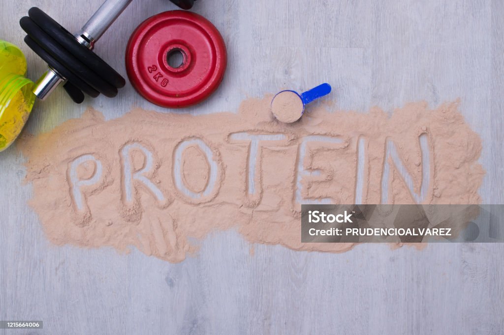 protein powder and dumbbells or gym weights Protein Stock Photo