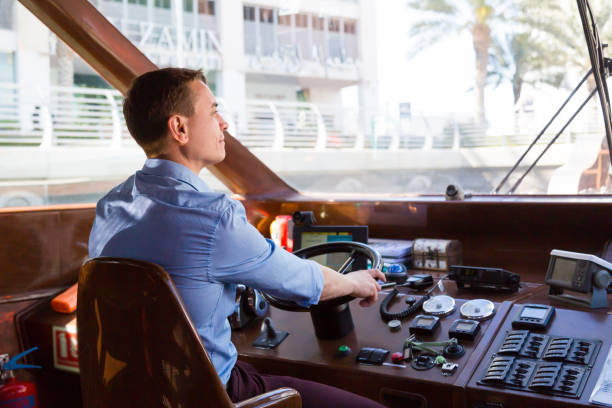 istock A man drives a sea pleasure boat. 1215665332