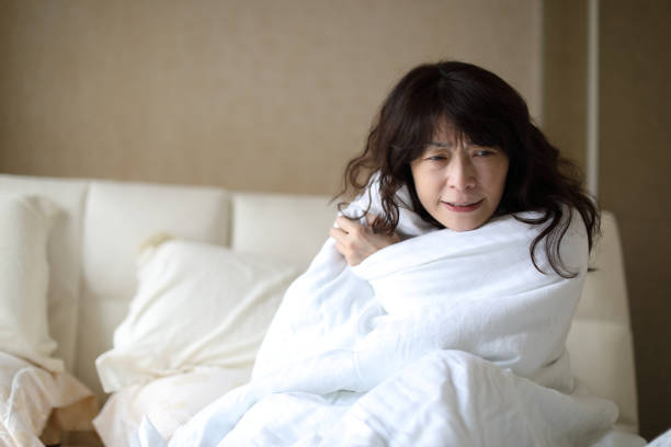 istock Sick woman with high fever 1215666101