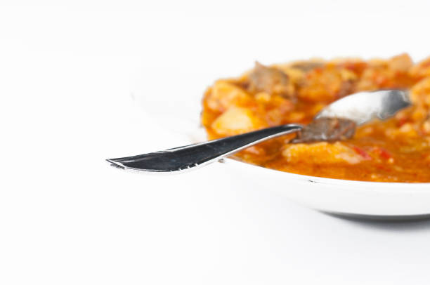 Cooked dish on a plate isolated on white background