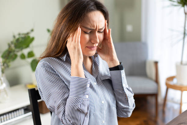 istock Young tired working woman at home office 1215669001