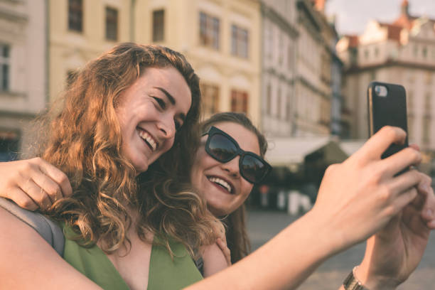 istock Girlfriends taking selfies in the city streets 1215669447