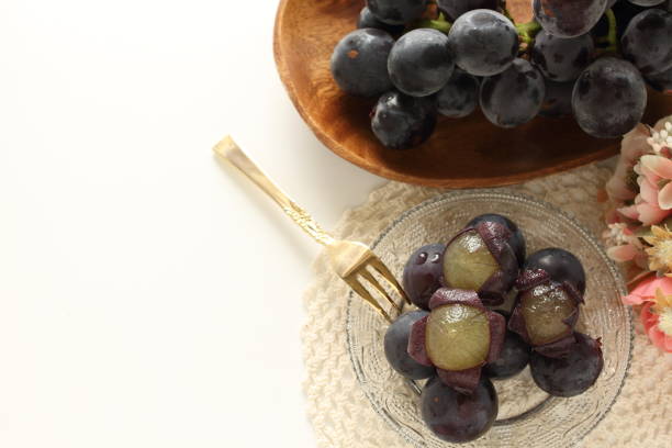 istock peeled Japanese grape on dish with copy space 1215669459