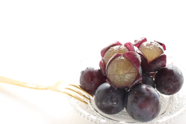 istock peeled Japanese grape on dish with copy space 1215669505