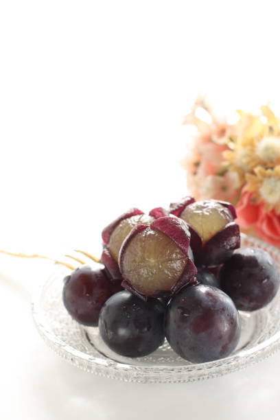 istock peeled Japanese grape on dish with copy space 1215669523