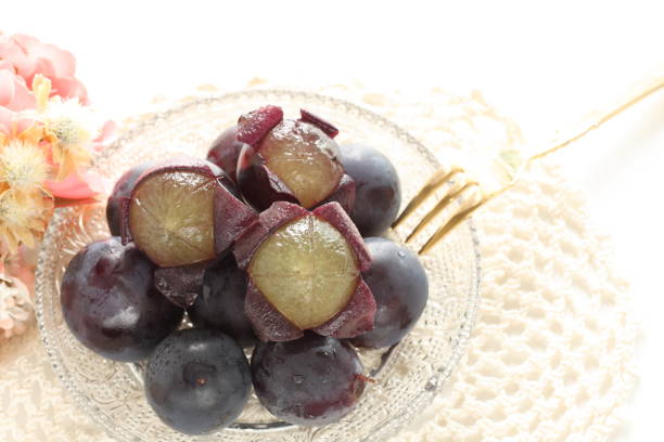 istock peeled Japanese grape on dish with copy space 1215669561