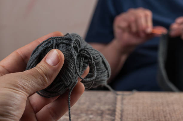 istock Woman hands knitting crochet.Crochet hook. 1215669627