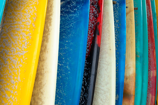 Texture of surfboards, covered in paraffin, stored waiting for a surfer on the beach of Canggu, south of Bali, Indonesia, on a hot August day.