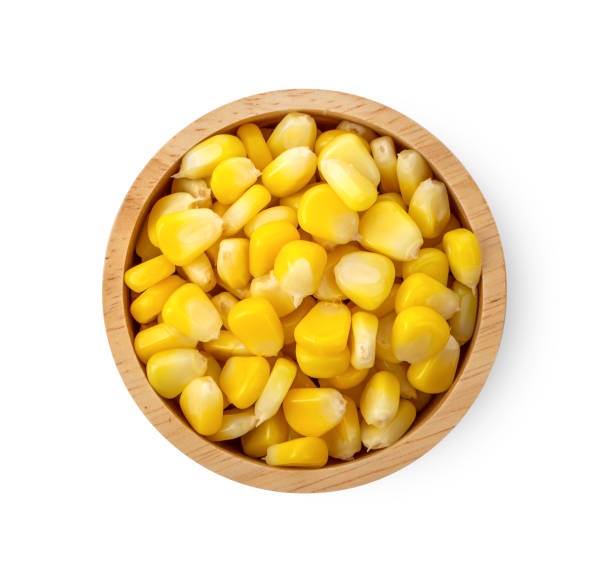 istock corn seeds in wood bowl isolated on white background. top view 1215670644