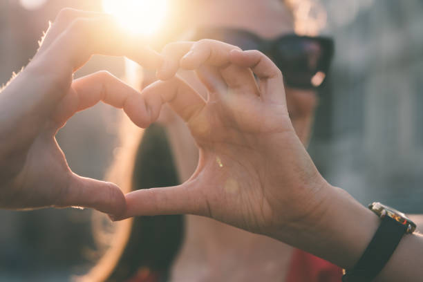 istock Best girlfriends making heart shaped hands 1215671622