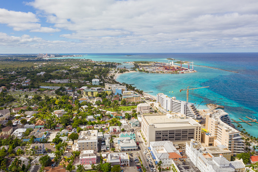 Drone aerial view of building  shop and cruise port with Passengers disembarking from cruise ships in the port of Nassau Bahamas